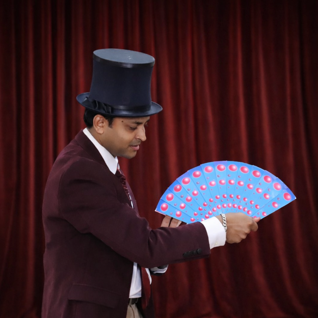 Darshan performing close-up magic for guests